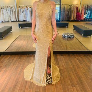 Fitted fully beaded high neck gown with slit skirt